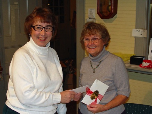 2010-12-01 Ronnie presents a token of the Society's appreciation to Norma at the December business meeting. DSC00857.jpg